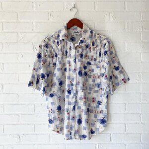 Vintage floral button up about an XL cream and blue 50% polyester 50% cotton
